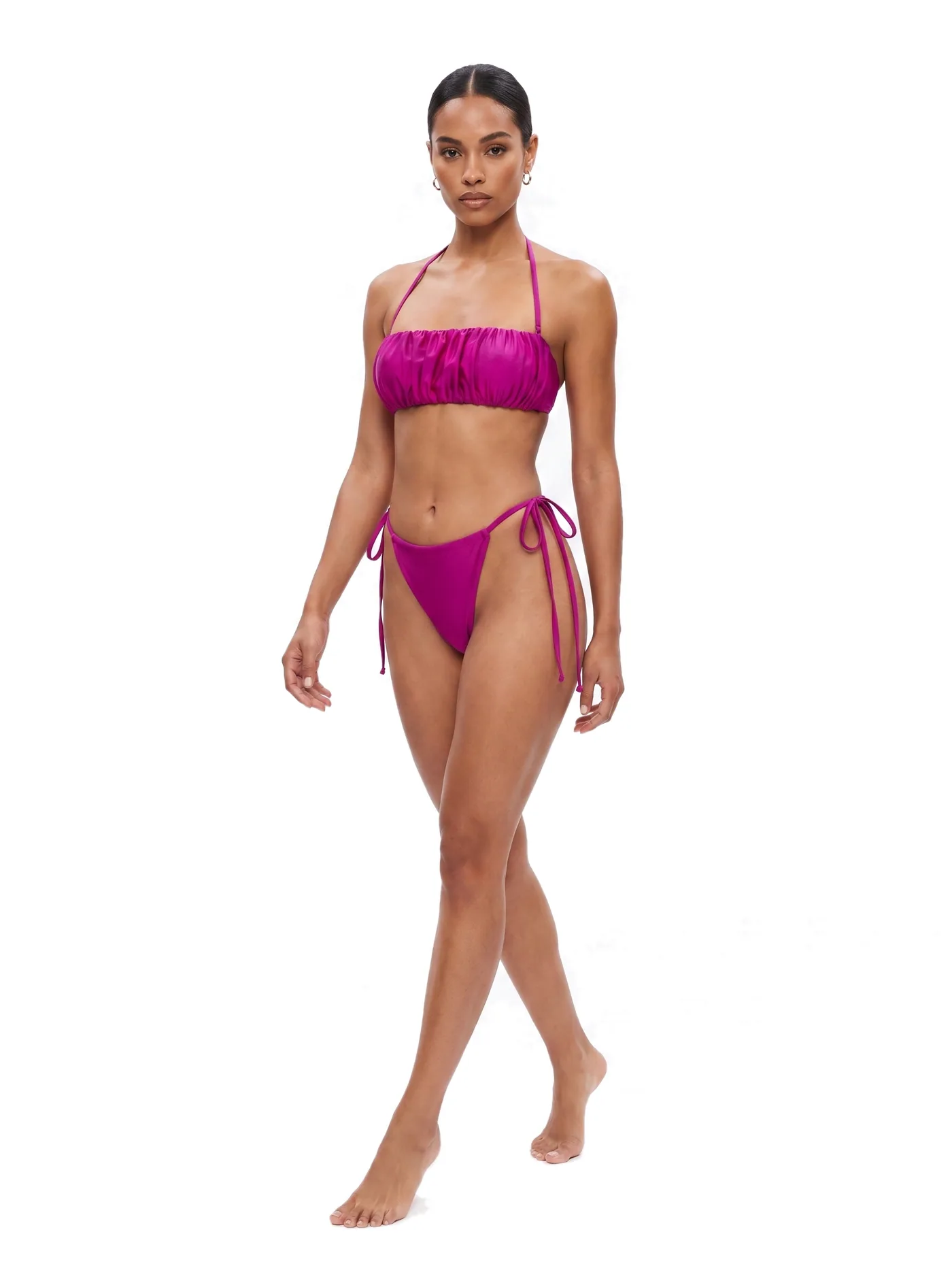 A magenta textured bandeau bikini with tie-side briefs, photographed on a white studio ground.