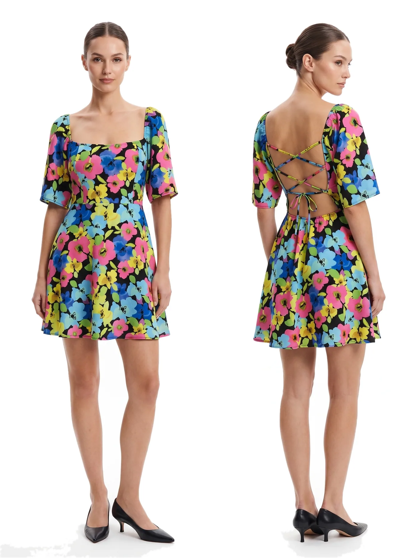Front and back views of a brightly printed floral mini dress with puff sleeves and an open back, photographed together on a white studio ground.